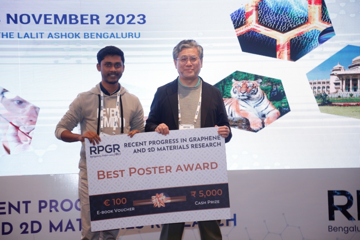 Photo of Mr. Puranjay Saha receiving the best poster award.